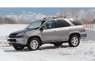 Driver’s side of  2001 Silver MDX on snow.