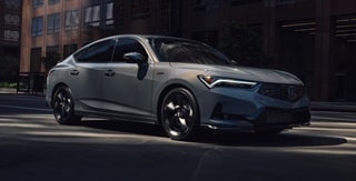 2026 Acura Integra 3/4 front view driving in Urban Gray Pearl. 2026 Acura Integra 3/4 front view driving in Urban Gray Pearl.