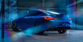 2026 Acura Integra A-Spec with Technology Package in Double Apex Blue Pearl rear view. 2026 Acura Integra A-Spec with Technology Package in Double Apex Blue Pearl rear view.