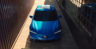 2026 Acura Integra front top view in Double Apex Blue Pearl. 2026 Acura Integra front top view in Double Apex Blue Pearl.