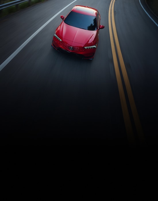 2026 Acura Integra A-Spec with Technology Package shown in Performance Red Pearl, driving on the road. 2026 Acura Integra A-Spec with Technology Package shown in Performance Red Pearl, driving on the road.