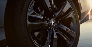 2025 Acura TLX Technology Package in Liquid Carbon Metallic with gloss black 20-inch alloy wheels. 2025 Acura TLX Technology Package in Liquid Carbon Metallic with gloss black 20-inch alloy wheels.
