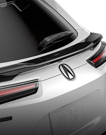 2026 Acura ADX shown in Platinum White Pearl featuring the Mid-Tailgate Spoiler accessory. 2026 Acura ADX shown in Platinum White Pearl featuring the Mid-Tailgate Spoiler accessory.