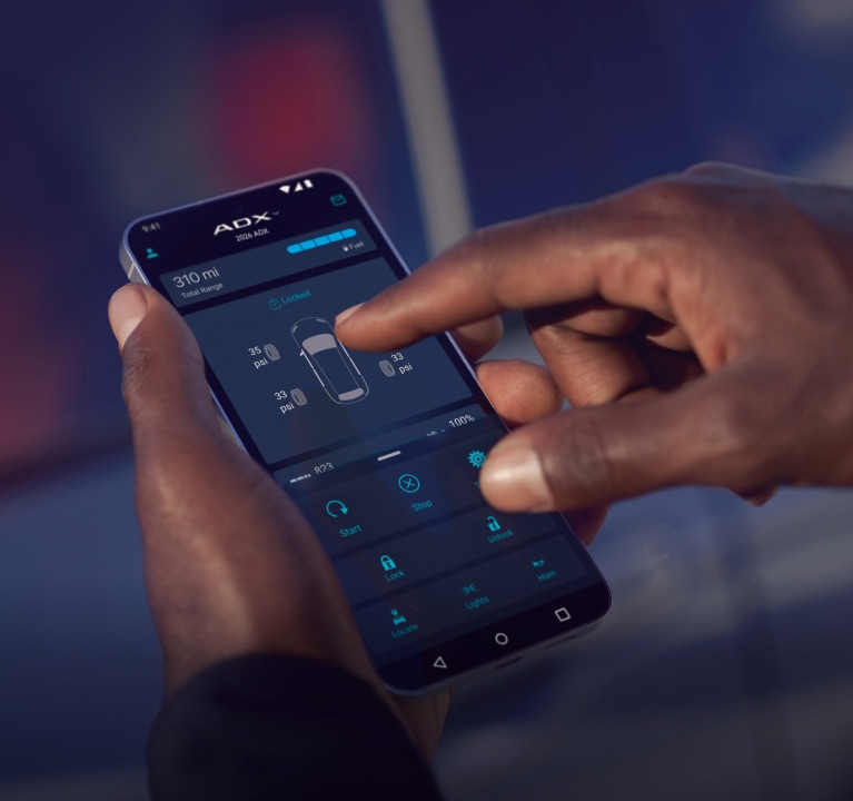 2026 Acura ADX close-up of a man’s hands using AcuraLink® connected services. (Premium Compact SUV). 2026 Acura ADX close-up of a man’s hands using AcuraLink® connected services. (Premium Compact SUV).