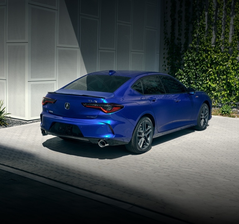 2025 Acura TLX A-Spec Package in Apex Blue Pearl 3/4 rear view. 2025 Acura TLX A-Spec Package in Apex Blue Pearl 3/4 rear view.