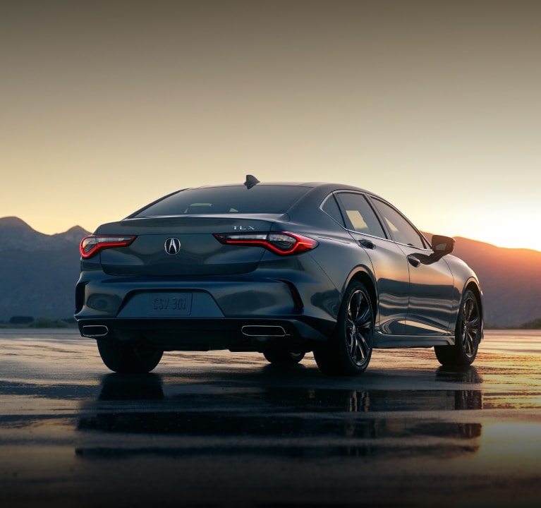 2025 Acura TLX Technology Package in Urban Gray Pearl 3/4 rear view. 2025 Acura TLX Technology Package in Urban Gray Pearl 3/4 rear view.