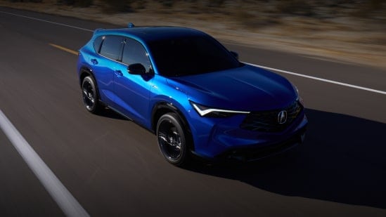 Acura 2025 ADX in Adriatic Sea Blue Meatallic driving on a desert highway